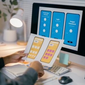 Empathy design: understanding users for meaningful experiences ux designer is reviewing paper prototypes of a mob nlr769m